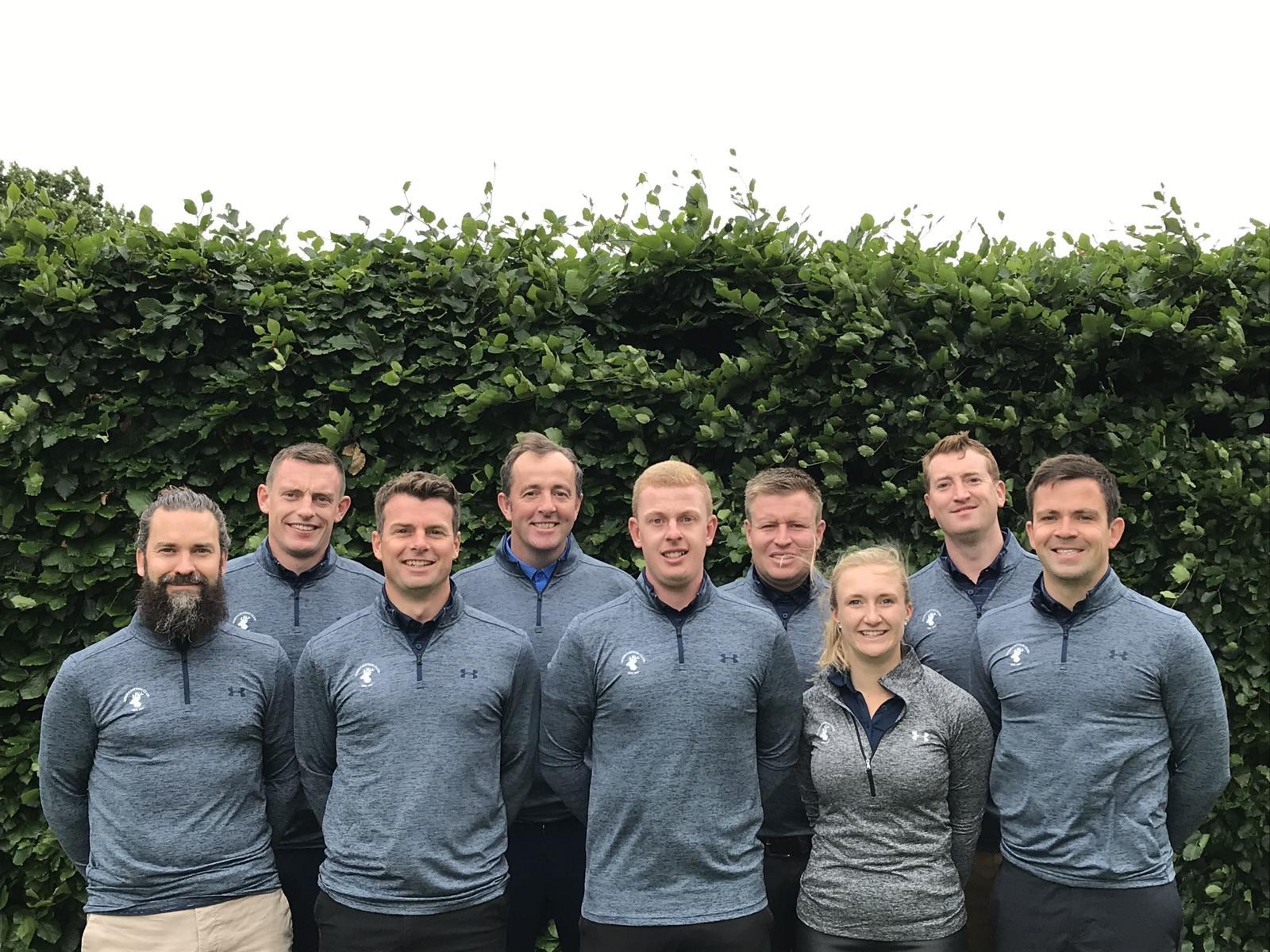 The Roehampton professional golf team standing together outdoors